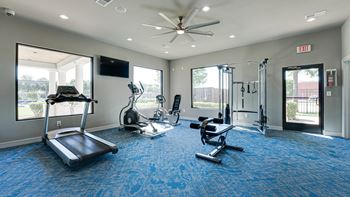 the apartments at masse corner 205 fitness room  at Highland Luxury Living, Texas, 75067